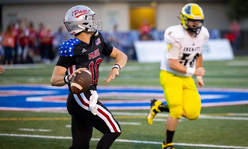 A football player prepares to throw the ball